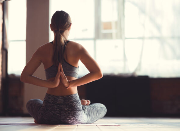 Young instructor in a yoga class